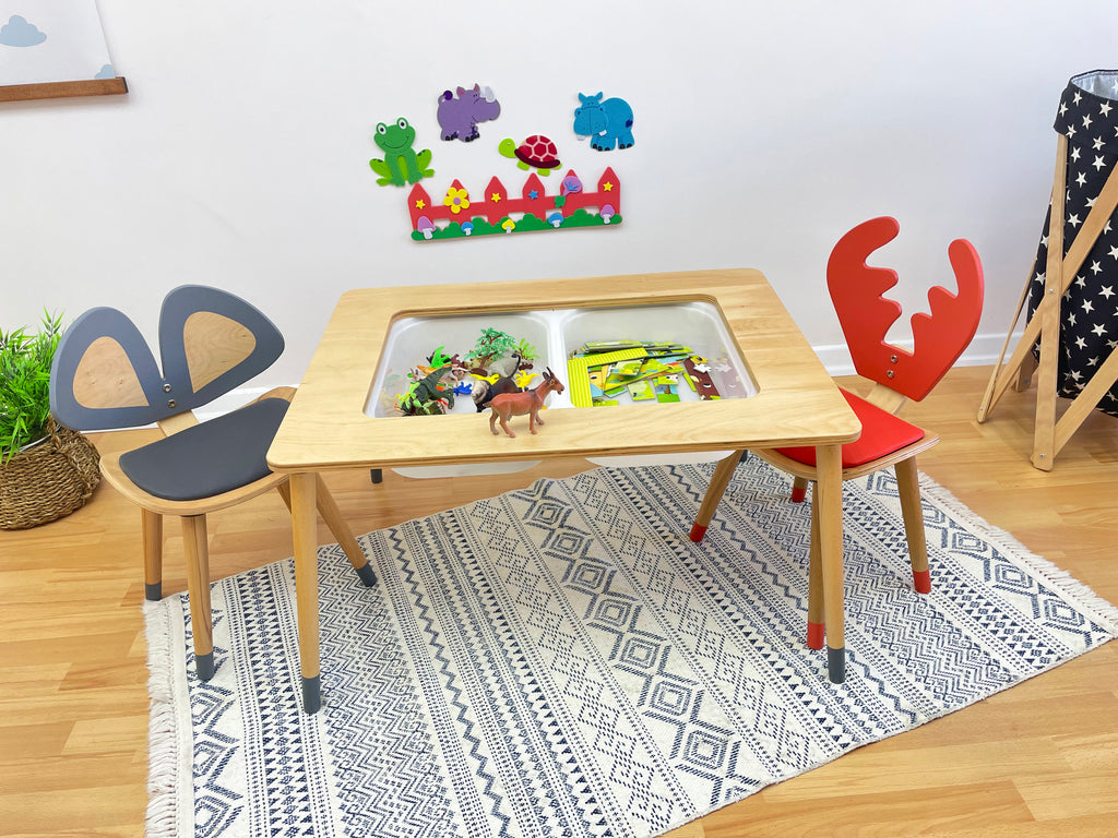 a child's table and chairs in a child's playroom