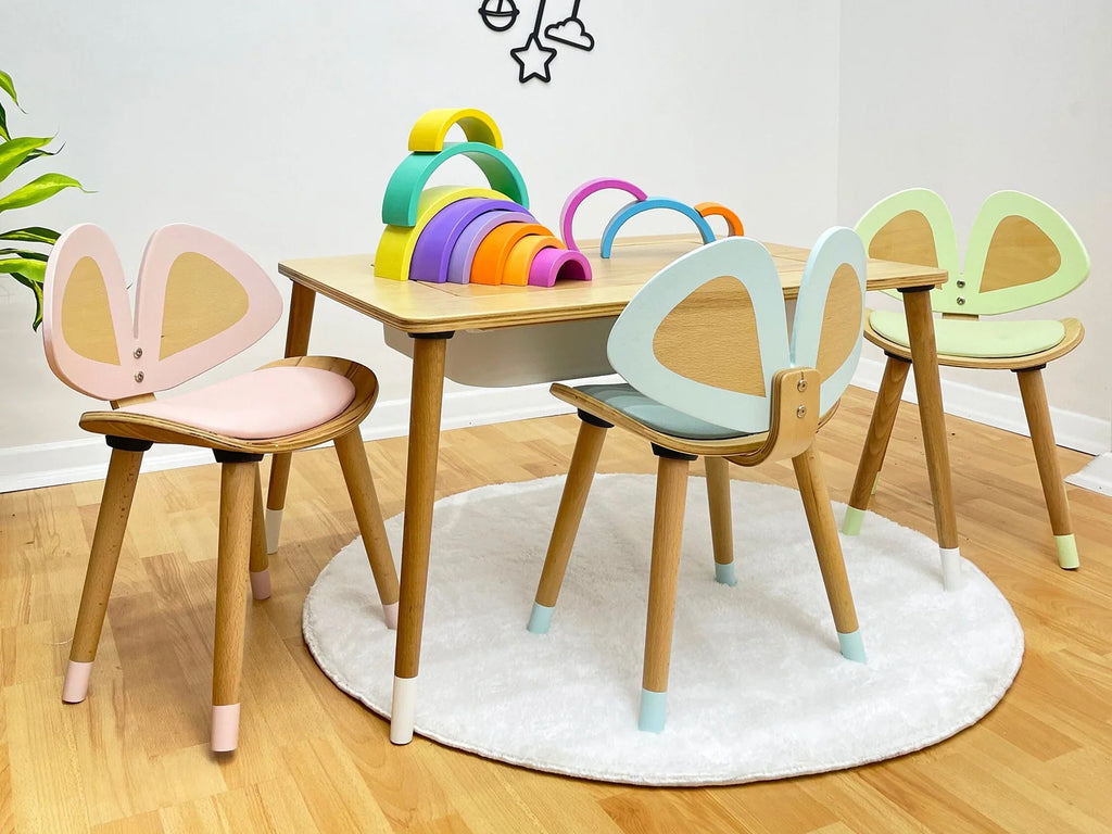 a child's table and chairs in a room