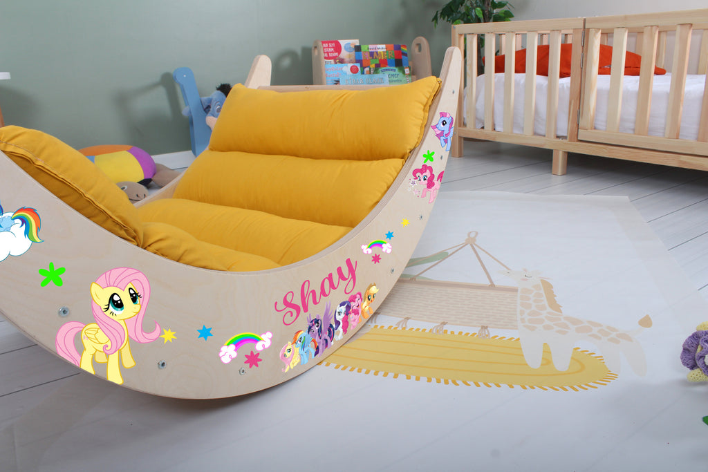 a child's room with a rocking horse bed