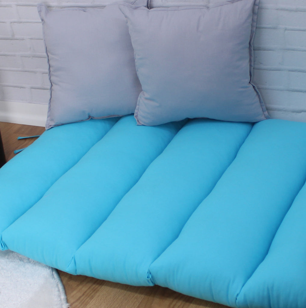 a bed with two pillows on top of it