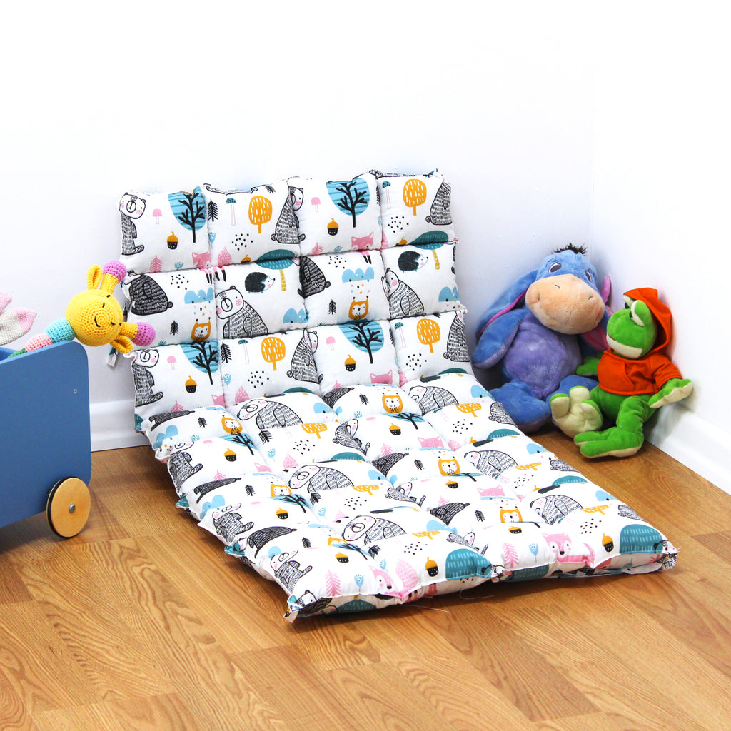 a child's bedroom with a bed and toys