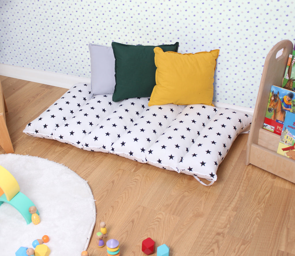 a child's room with a bed and toys