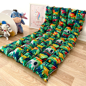 a child's bed with a jungle theme