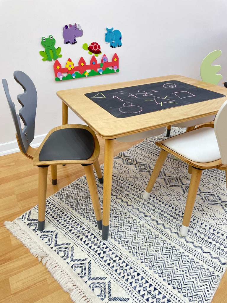 a blackboard and some chairs and a rug